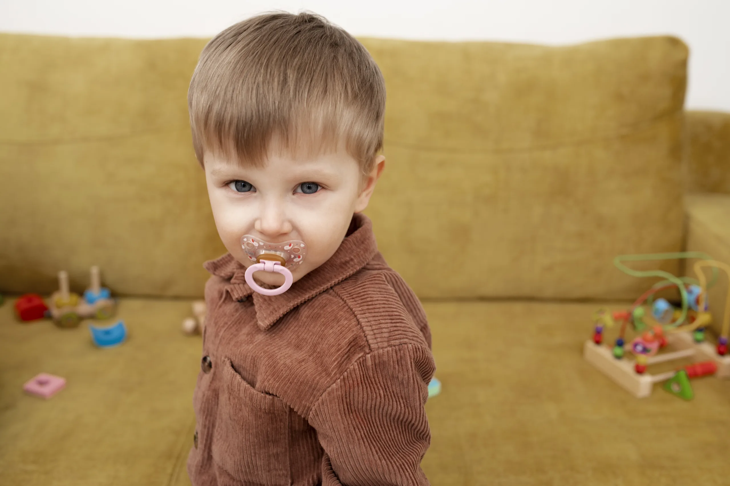 A toddler with teething pacifier